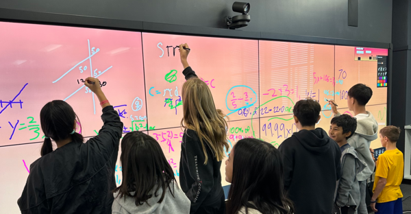 XCITE IDEA Wall with Children Doing Math